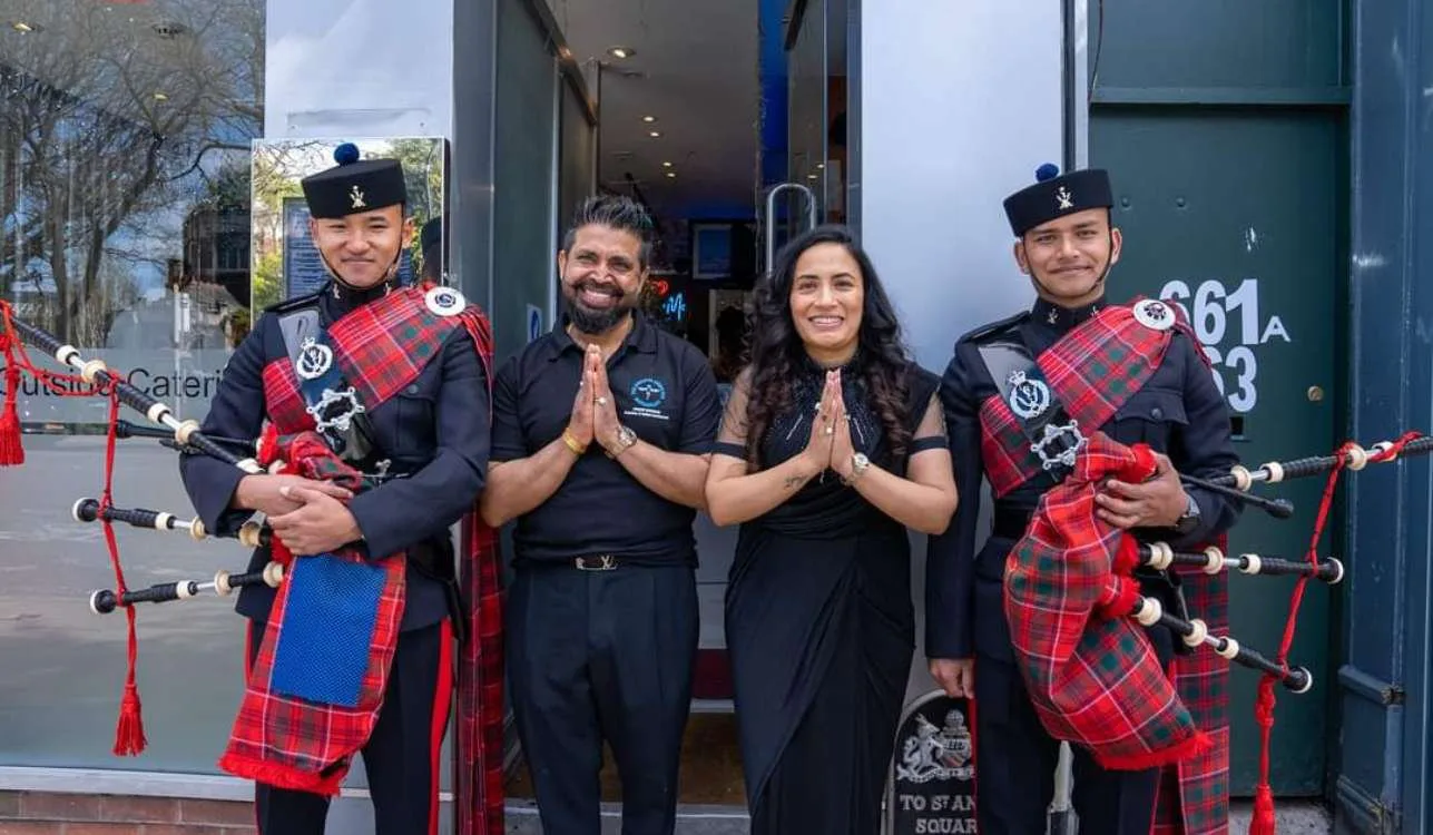 Pipers and the Third Eye family outside 661 Wilmslow Road